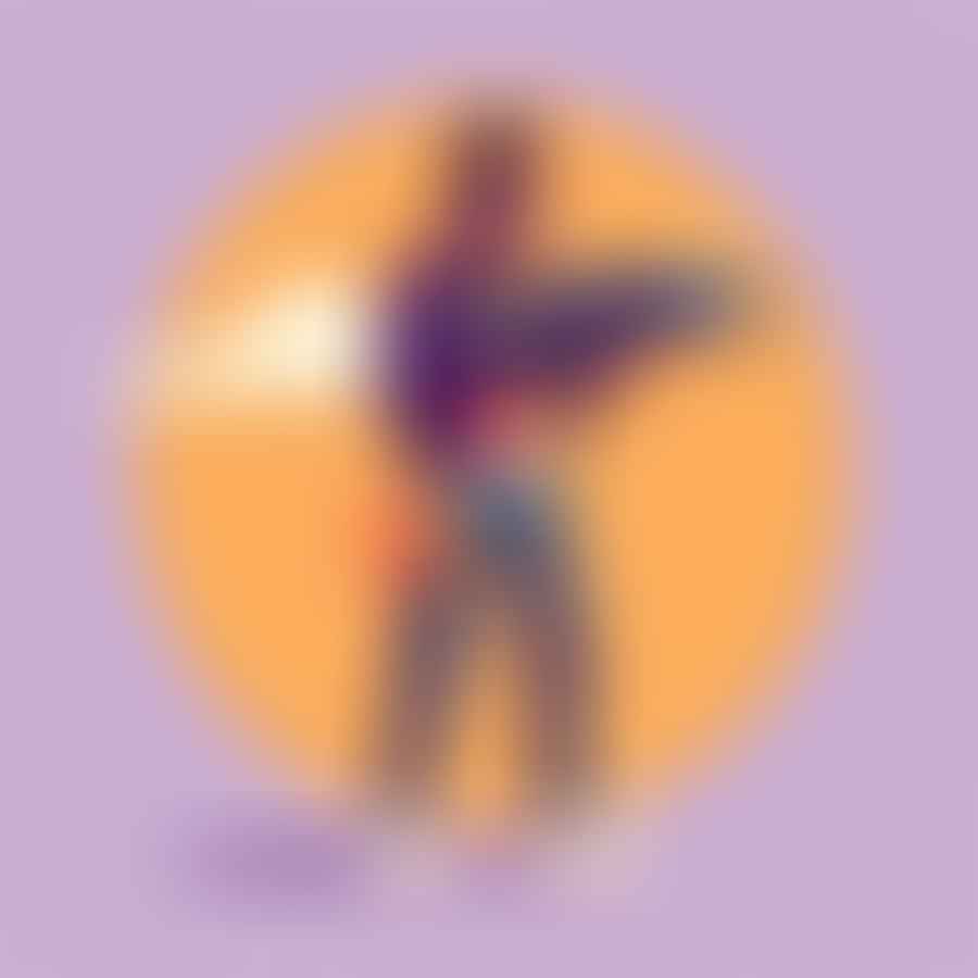 A person standing in a balanced stance, holding a Nerf blaster.